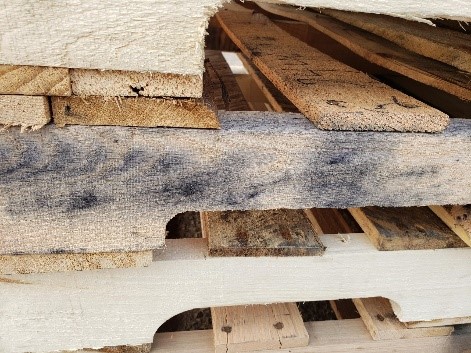 Close-up of iron stain discoloration on pallet lumber
