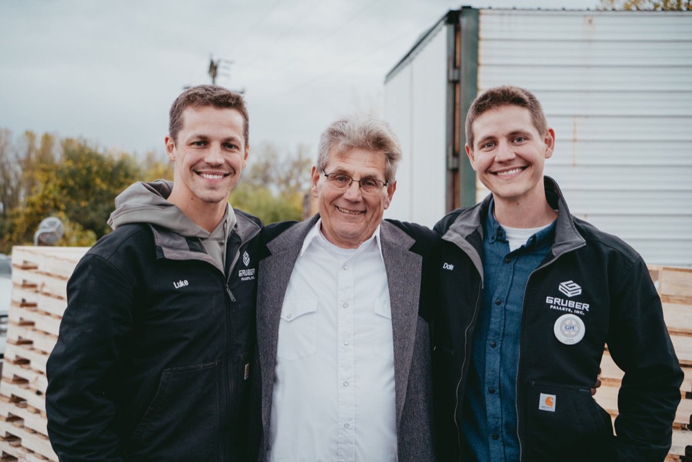 Luke, Dale Sr. and Dale Jr. Gruber standing together outside the plant